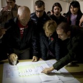 Lama Ole, Caty and friends are shown the plans to transform the Beaufoy