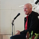 Lama Ole Nydahl giving a lecture in the main hall of the Beaufoy Institute, London April 2013