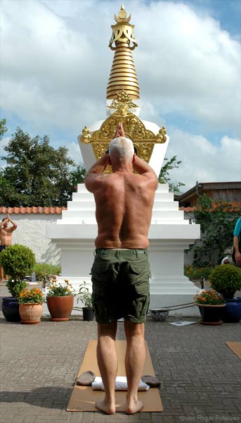 Lama Ole Nydahl doing prostrations by the stupa in Rødby, Denmark