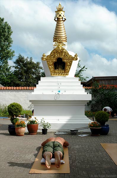 Lama Ole Nydahl doing prostrations by the stupa in Rødby, Denmark