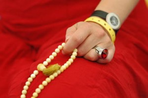 a mala being used in meditation